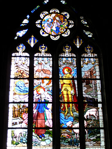 Stained Glass Window of Joan of Arc with Saints and Angels