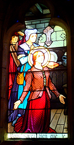 Stained Glass Window of Joan of Arc on her knees