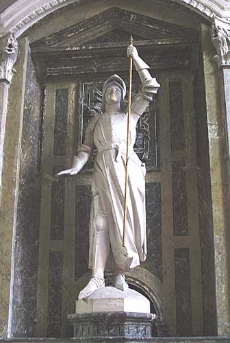 Statue of Joan of Arc Holding a Spear inside a church in France