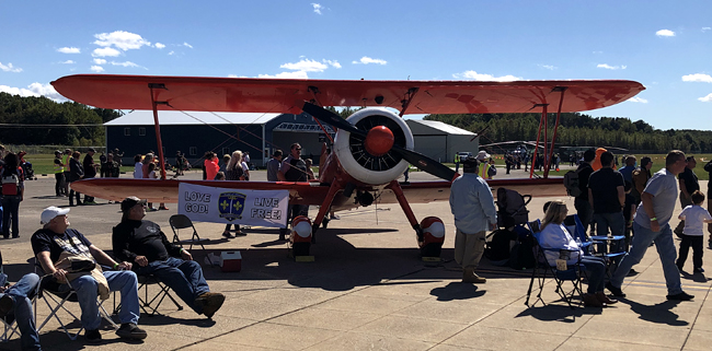 The Rebel Yell! Airplane at airshow 2021 with Love God Live Free Banner
