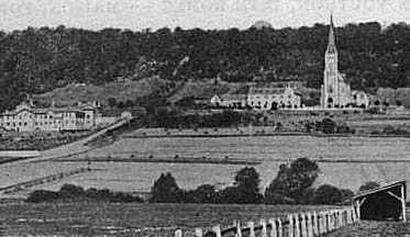 picture of the Saint Joan of Arc 
Basilica from across the valley